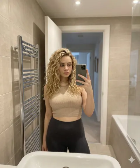 Golden Hair Bathroom Mirror Selfie