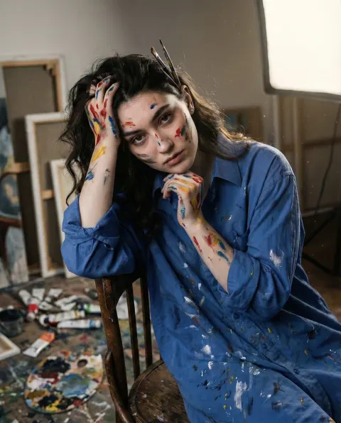 Exhausted Artist In Messy Studio