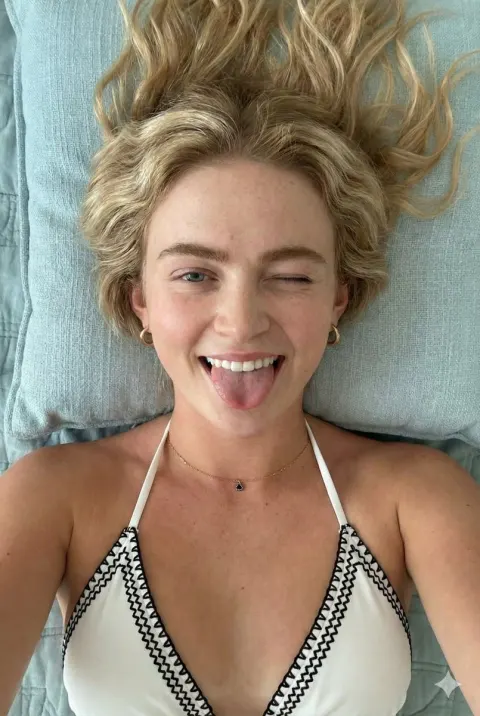 Playful Blonde Winking Tongue Out