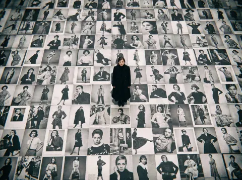 Actress in Black Coat Above Model Billboards