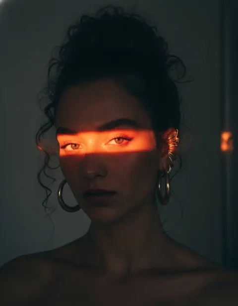 Crimson Light: Striking Portrait