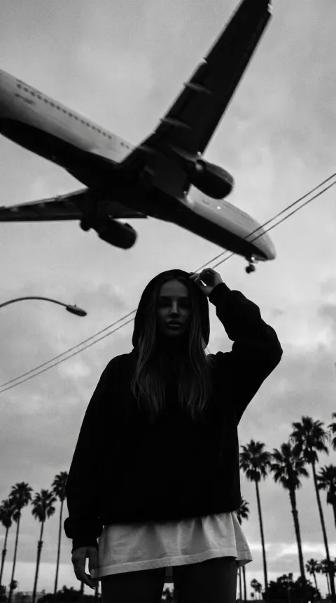 Mystery Girl Beneath Dusk Airplane