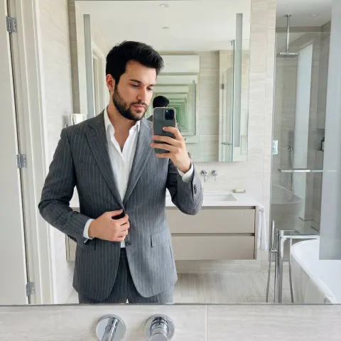 Confident Suit Selfie In Modern Bathroom