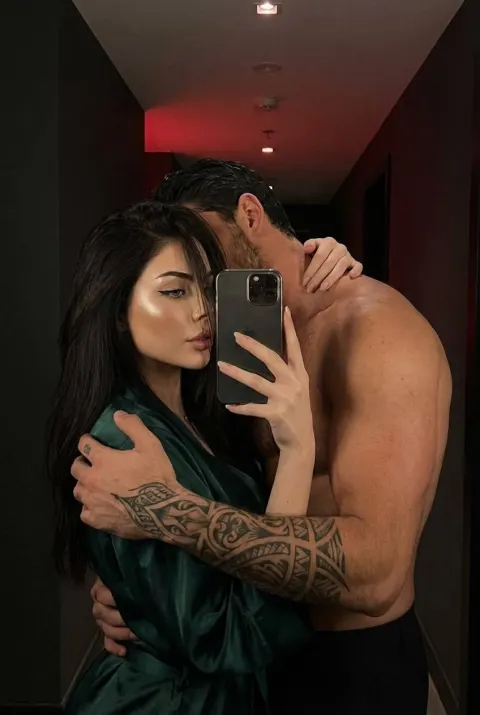 Mirror Selfie with Muscular Partner