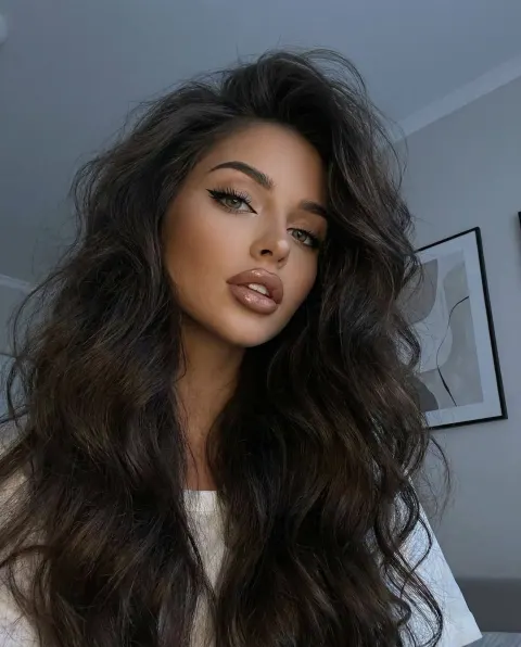 Sultry Wavy-Hair Beauty in Low Angle
