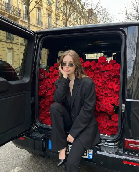 Cool Woman Against Rose Wall