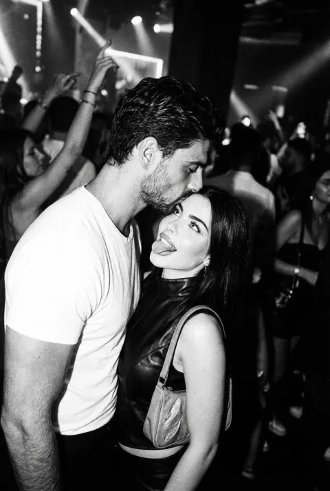 Rebel Couple Nightclub Kiss