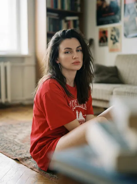 Red Tee Woman Gazing into Camera