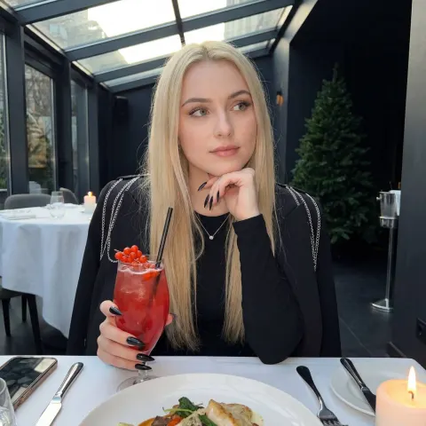 Blonde Beauty in Dim Restaurant