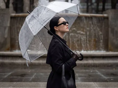 Rainy Elegance Under Umbrella
