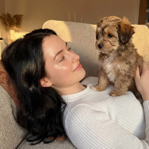Golden Hour Model with Puppy on Sofa