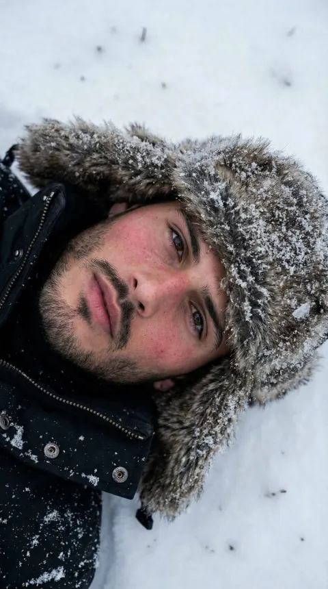 Man Lying in Snow Close-up
