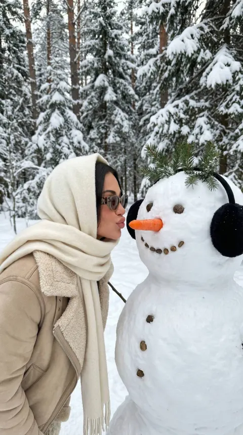 Playful Snowman Kiss in Winter Forest