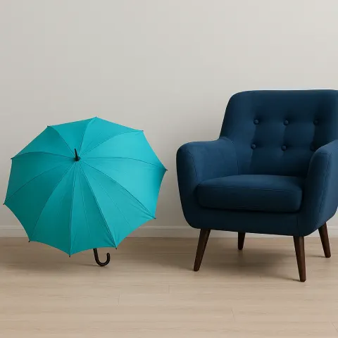 Navy Blue Armchair Alongside a Turquoise Umbrella