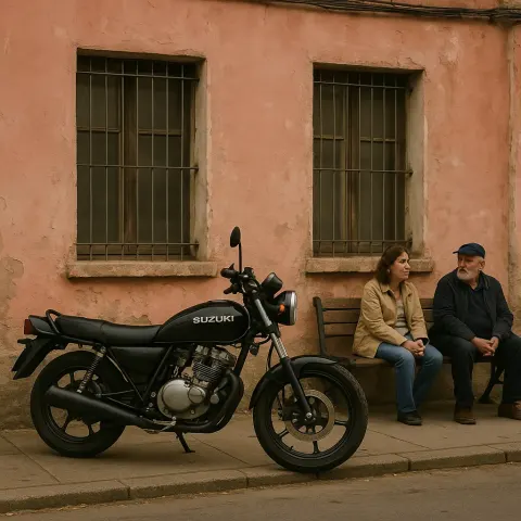 Black Suzuki Motorcycle Parked in Front of a Weathered Pink
