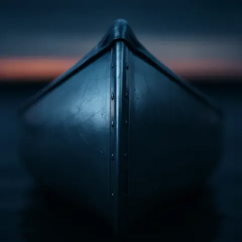 Polished Aluminum Canoe in Sharp Macro Focus Gleams under Dim