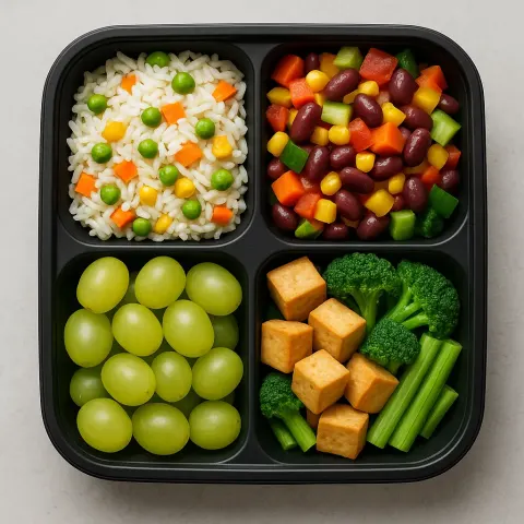 Meal Box with Four Compartments Containing Rice with Vegetables