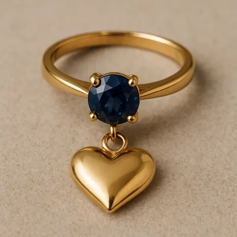 Engagement Ring Made of Gold Featuring a Sapphire