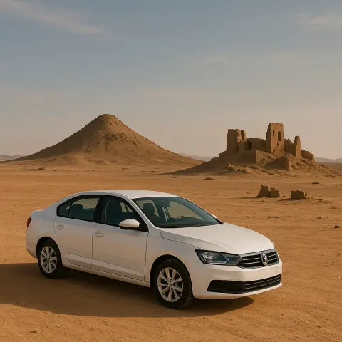White Car Parked on a Desert Landscape with a Solitary