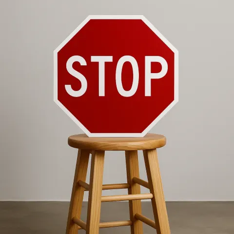Wooden Stool with a Red Stop Sign