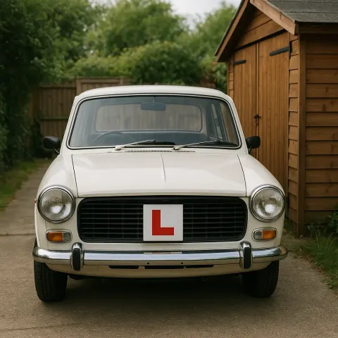 White Vintage Car with an "L" Plate Displayed