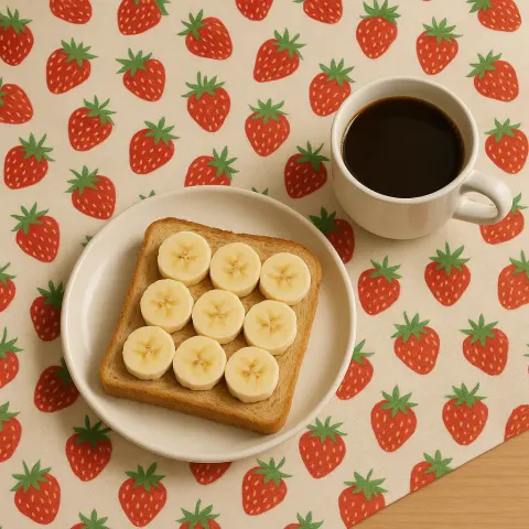 Plate with Sliced Banana on Bread and a Cup
