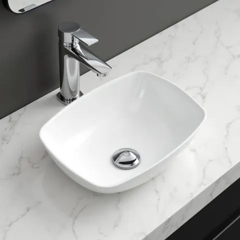 White Ceramic Sink With Steel Faucet on Marble