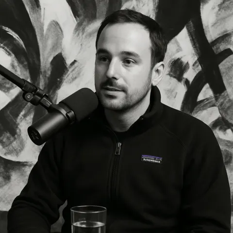 Person Wearing a Black Patagonia Jacket Is Seated in Front