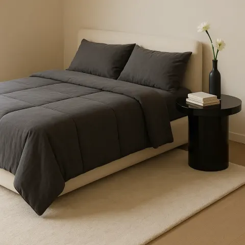 Sizable Rectangular Bed Covered with a Charcoal-gray Comforter
