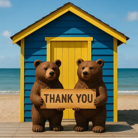 Two Bear Sculptures Holding a "Thank You" Sign in Front