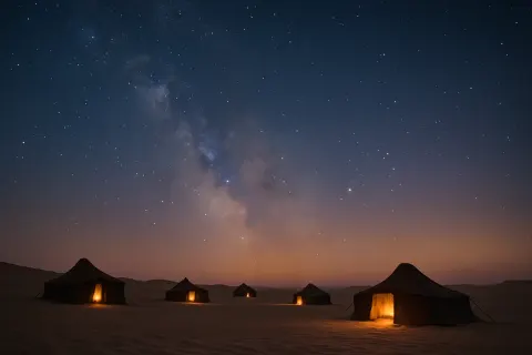 Scattered Handful of Nomadic Tents Glows Faintly under a Vast