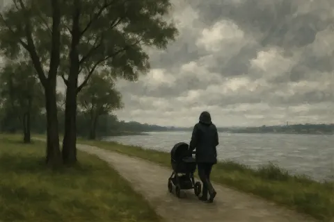 Cloudy Waterfront Scene with a Person Pushing a Stroller