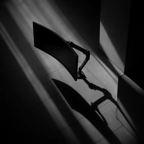 Single Curved Monitor on an Articulating Arm Is Dramatically Side-lit