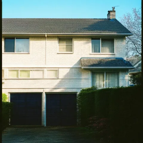 Grainy Suburban House in Deep Shadow