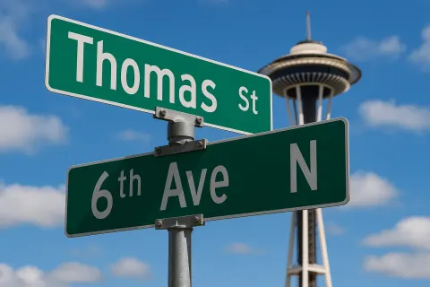 Street Signs for Thomas Street and 6th Avenue North