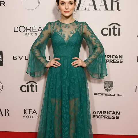 Woman Standing on a Red Carpet Wearing a Teal