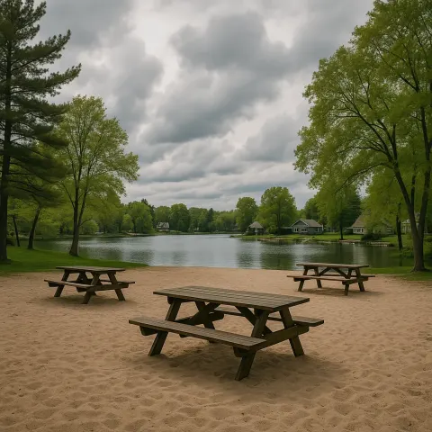 Sandy Lakeside Area with Picnic Benches