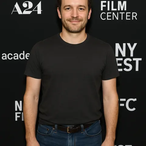 Man in a Dark Gray T-shirt and Blue Jeans