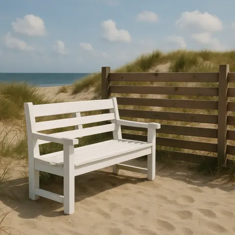 White Wooden Bench Sits on Sandy Ground