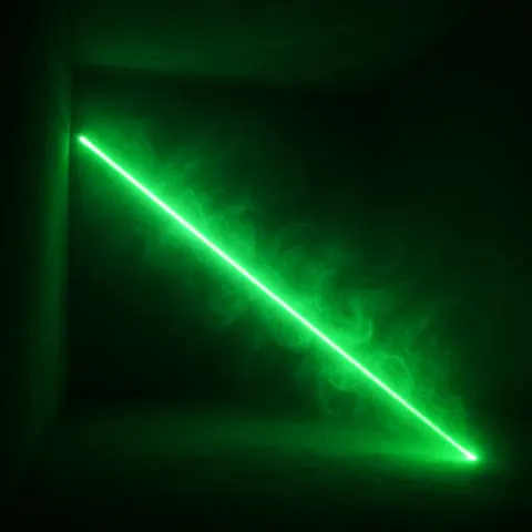 Radiant Laser Beam Pierces Through a Shadowy Room