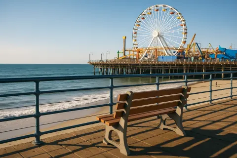 Wooden Pier with a Bench Overlooks the Ocean