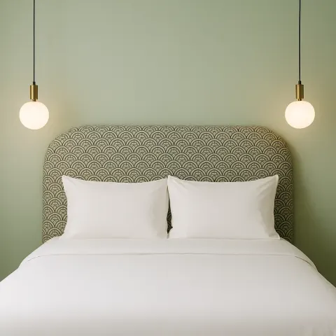 Neatly Made Bed with White Linens