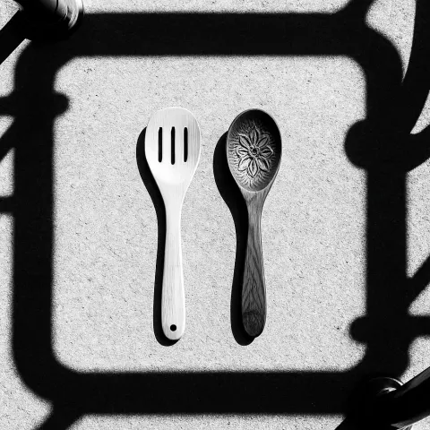 Two Distinct Wooden Spoons—one a Light Bamboo Slotted Spoon