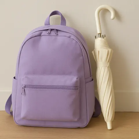 Cream Umbrella Alongside a Lavender-colored Backpack