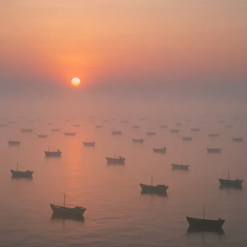 Numerous Tiny Fishing Boats Are Spread Far Across a Calm