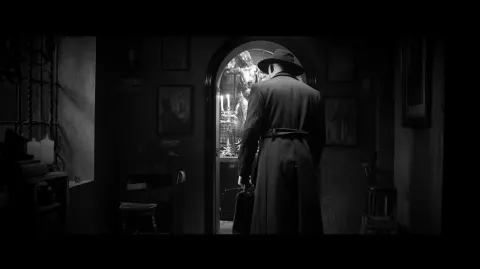 The detective discovers the hidden infernal shrine, black and white film noir