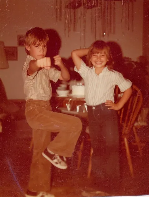 1. Siblings Awkward Poses candid snapshot 1970s, a brother age 8 and sister age 6 with brown hair st
