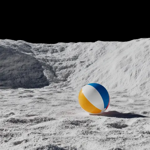 Whimsical white moonscape with one beachball on the surface with some color against a backdrop of de