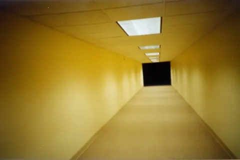 Photo of Endless empty pale beige yellow rooms, pale beige carpet, pale beige yellow walls