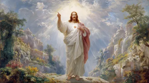The glorious Christ standing in radiant light, pointing to His heart with one hand while extending t